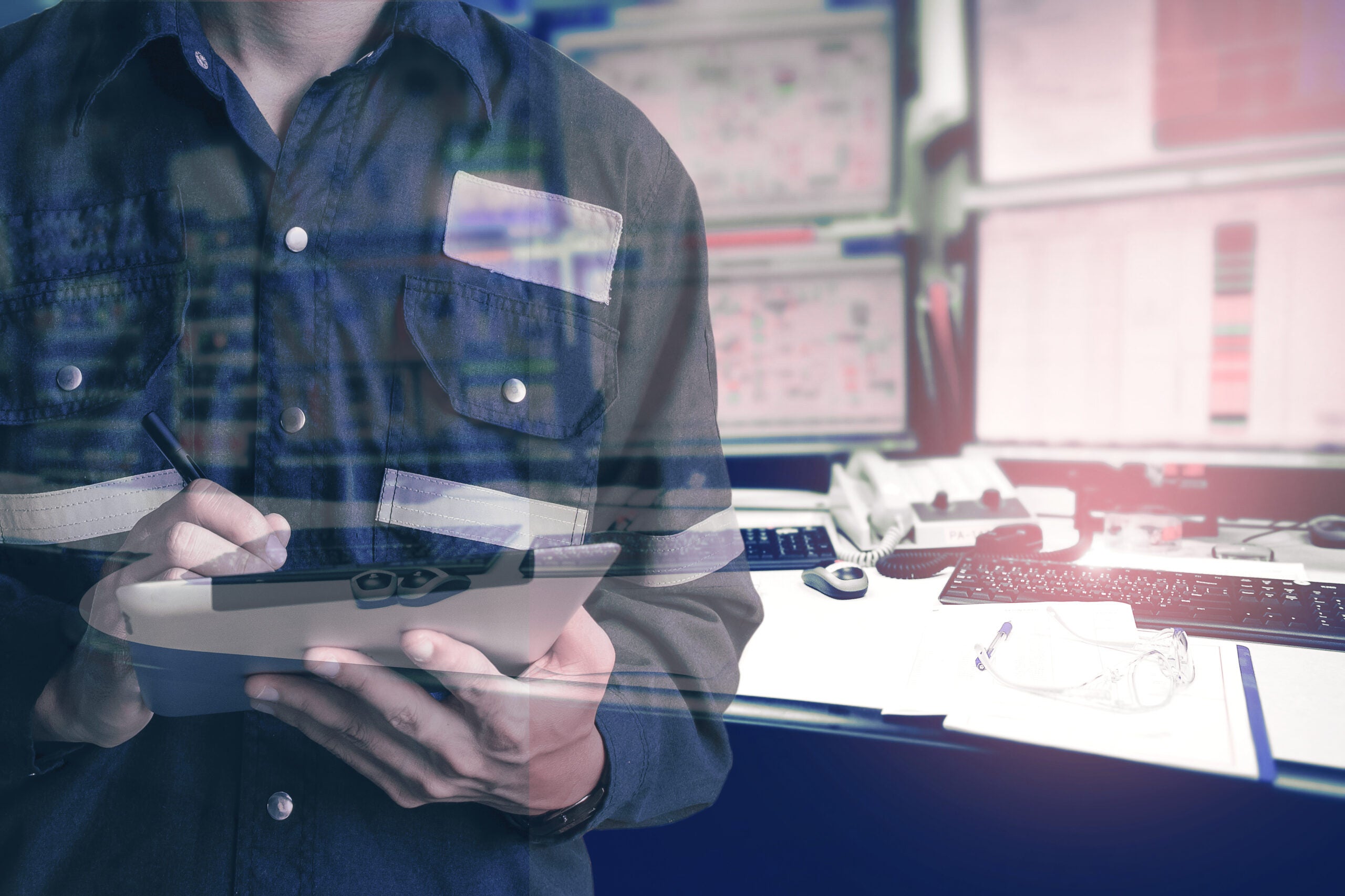 Double exposure of Engineer or Technician man in working shirt working with tablet in control room of oil and gas platform or plant industrial for monitor process, business and industry concept.