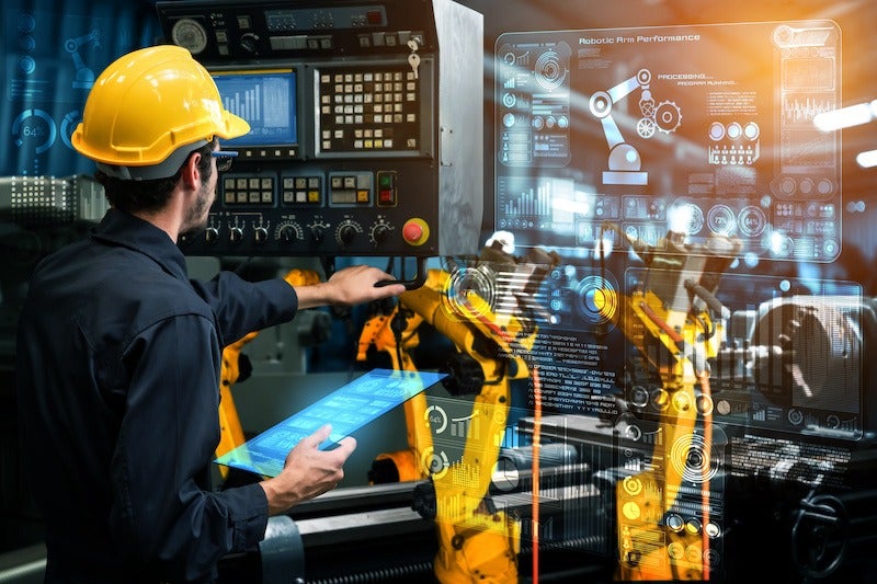 Smart industry robot arms for digital factory production technology showing automation manufacturing process of the Industry 4.0 or 4th industrial revolution and IOT software to control operation .