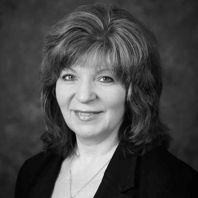 black and white photo of Dawn Cappelli, OT-CERT director at Dragos