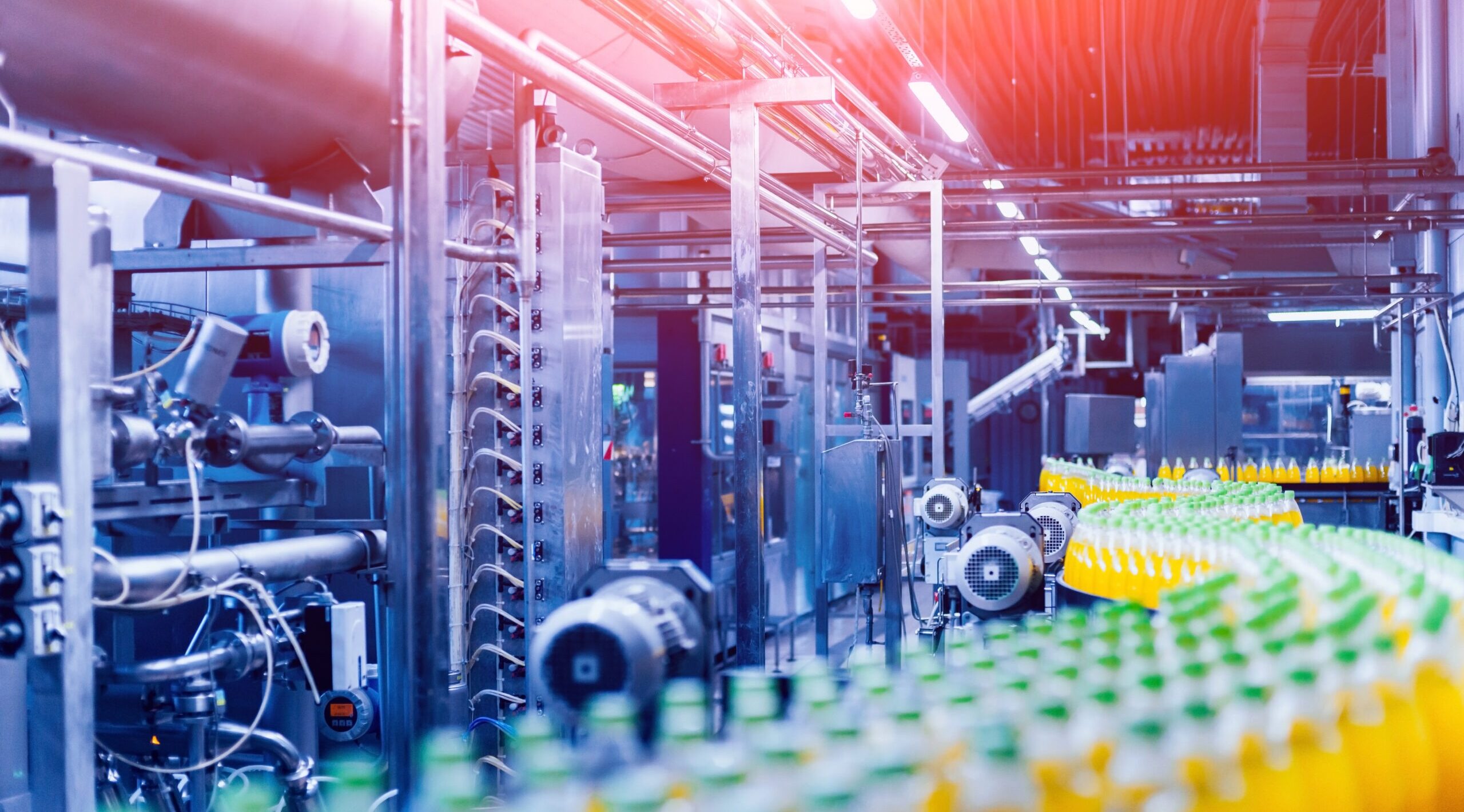 Beverage factory interior. Conveyor with bottles for juice or water. Modern equipments