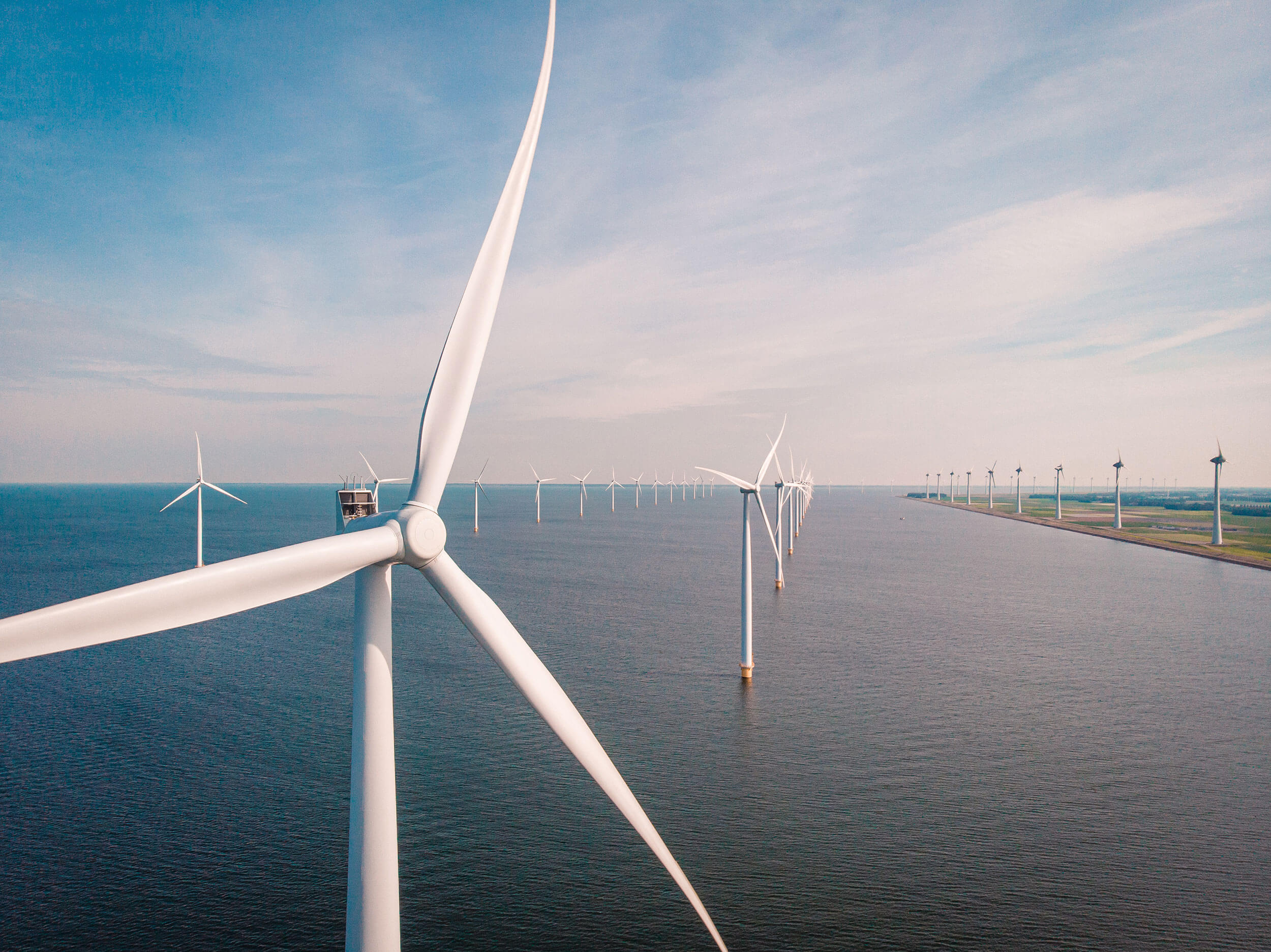 windmill farm renewable enrgy, green energy with windmill park in ocean and land