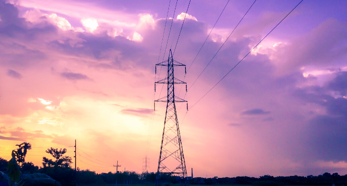 photo of electric line at sunset