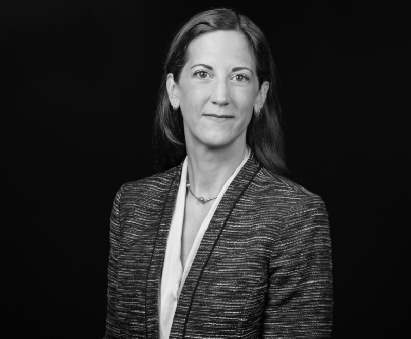 A black and white headshot of Meg Kammerud
