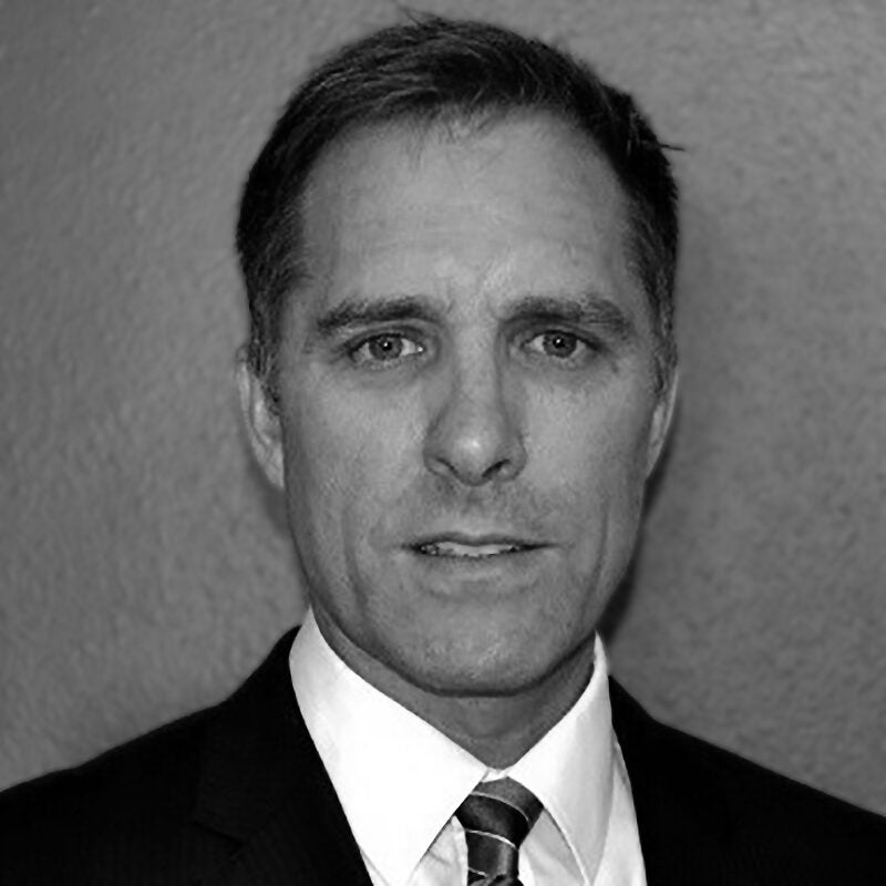 A black and white photograph of Steve Applegate